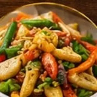 A mixed vegetable stir-fry in a serving bowl